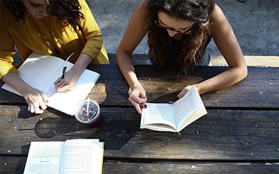 UB students studying at a picnic table
